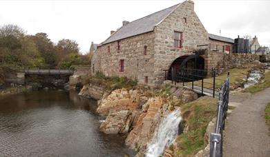 Pictured is Annalong Cornmill which has been beautifully restored. It is situated by the pretty Annalong Harbour at the foothills of the Mourne Mounta
