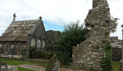 Photograph of the Movilla Abbey, grave stones and ruins