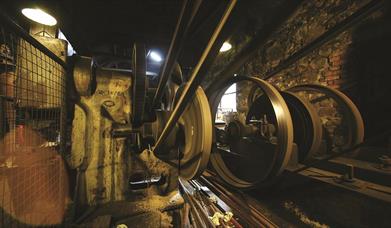 Industrial belts in an old stone mill.
