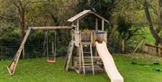 Image of a climbing frame, swing and slide set in the garden