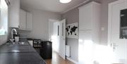 kitchen area with grey and white colour scheme