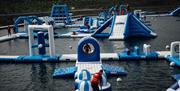 Image shows inflatables on the lake at Let's Go Hydro