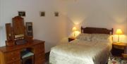 Double room with 2 bedside lockers and dressing table with mirror