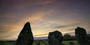 Image of the stones with a dimly lit sky behind