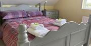 Image of a wooden double bed