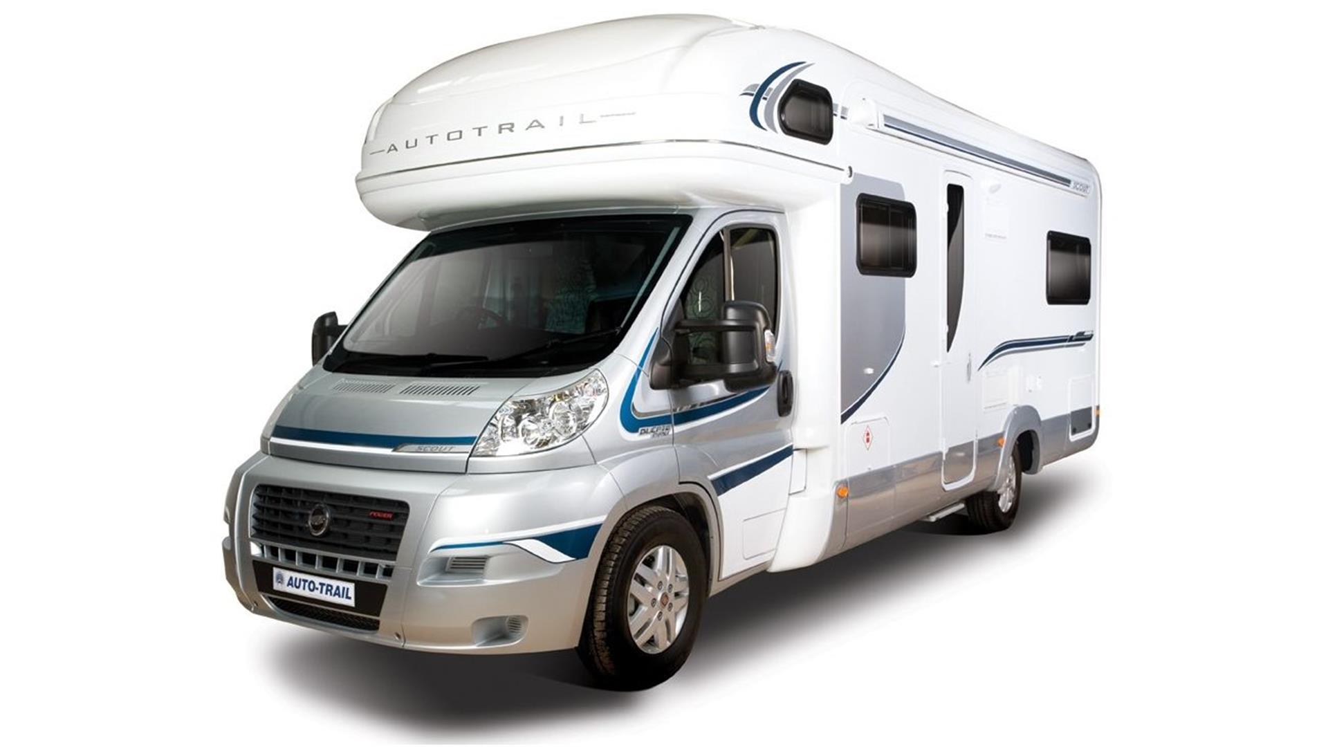 Image is of a silver and white motorhome