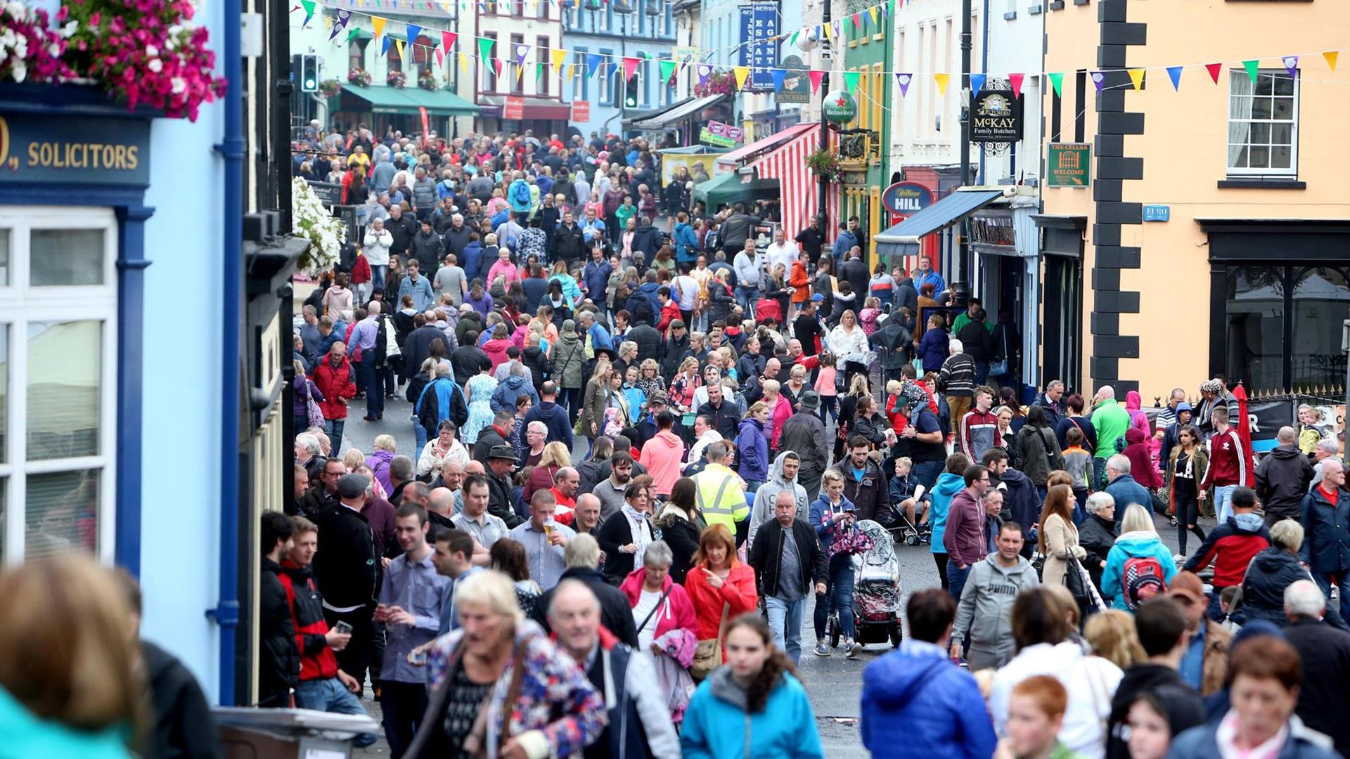 Crowds of people on a busy street in Ballycastle