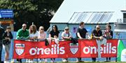 Parents enjoying the relaxing sunshine at the 2023 Foyle Cup
