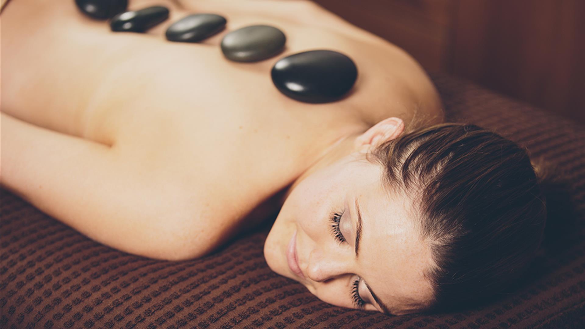 Lady enjoying a hot stone massage