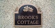 a photo of a sign saying brooks cottage