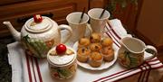 Matching tea set and mini muffins