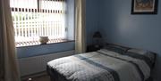 Blue room with double bed