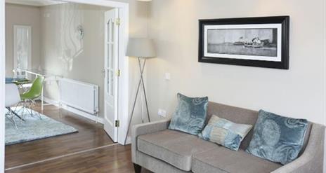 Image of sofa bedside double doors into dining area