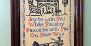 Image shows tapestry on with with welcome message