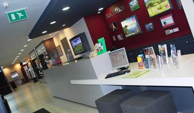 Image of the box office with a desk with various brochures