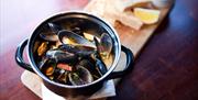 A main meal, mussels with bread