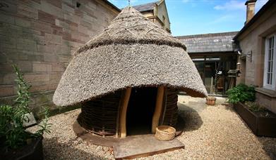 Photo of the Monks Hut set within it's own courtyard of North Down Museum
