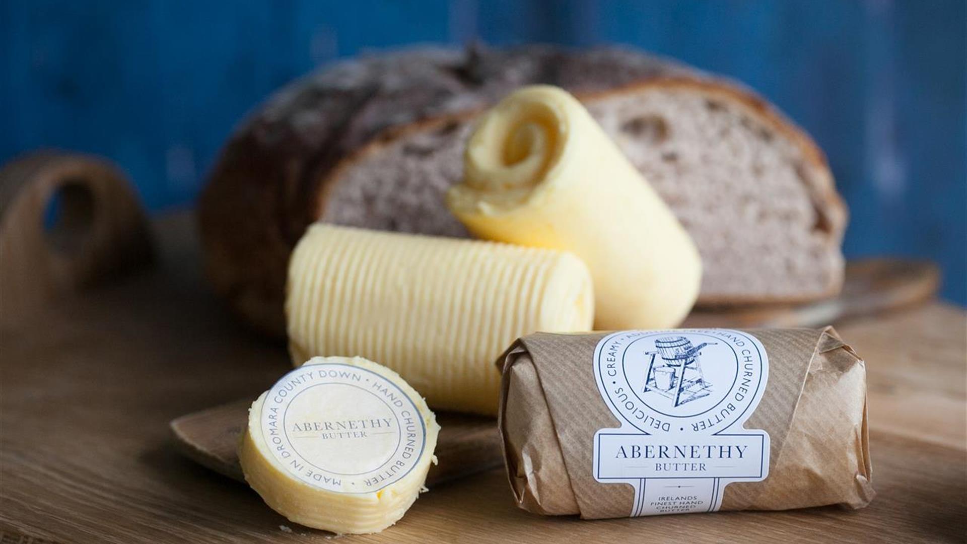 Image shows small rolls of butter with Abernethy packaging