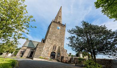 Image of the front of Bangor Abbey on a bright sunny day