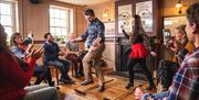 Man joins in dancing on Belfast Trad Trail experience