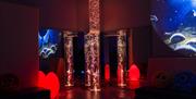 Bubble tube lights and space projector in Sensory Room 1 at High Rise Lisburn