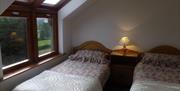 Twin room with 2 single beds and 1 bedside locker between