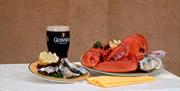 Lobster dish with oysters and a pint of Guinness