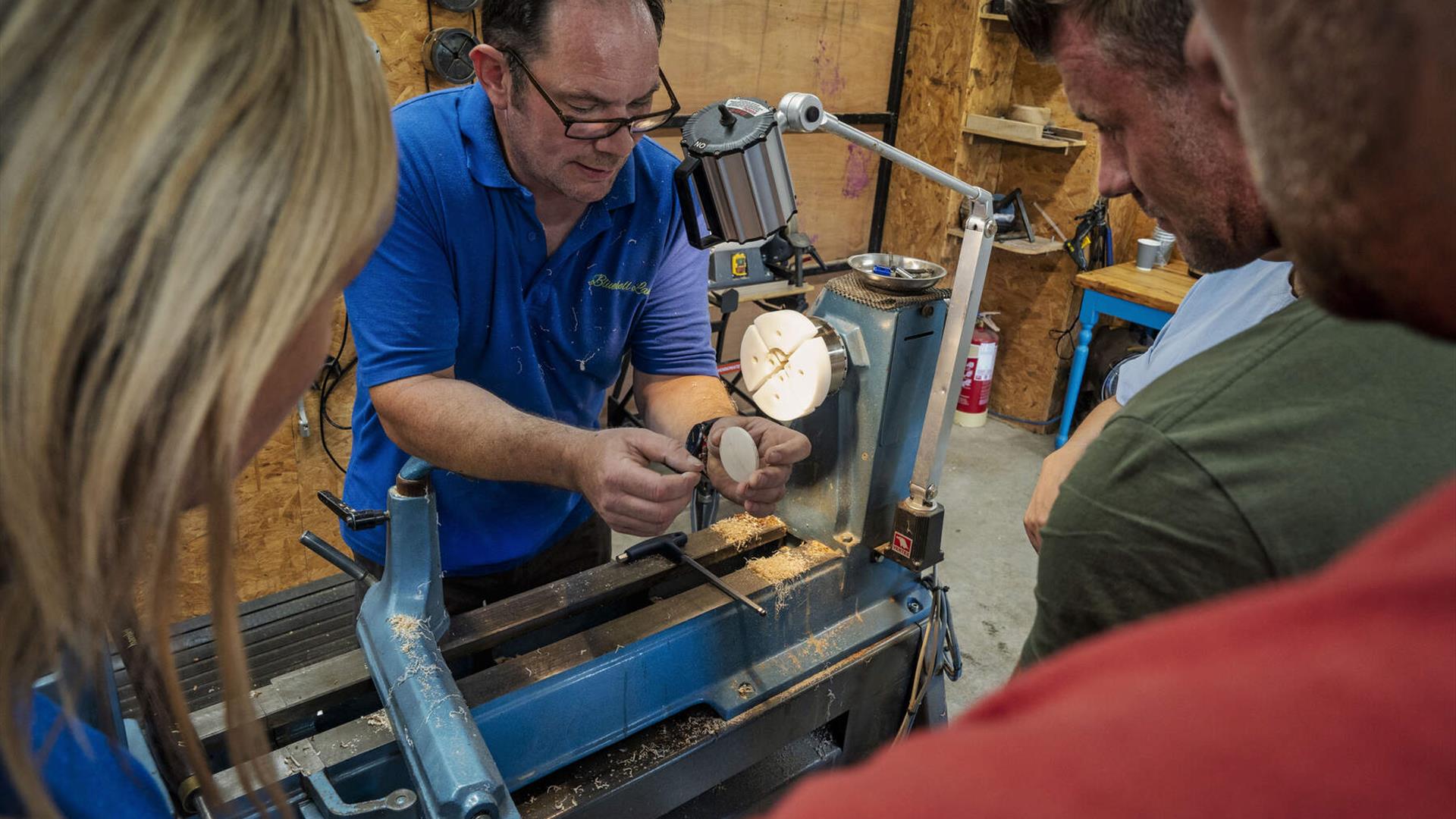 Padraig Carragher talks a group through the wood turning experience