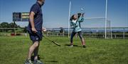 Ross Carr hosts the hurling skills section of the Gaelic Games and Craic experience