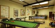 a photo of a games room with a snooker table