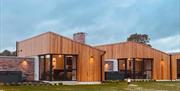 Outside image of individual lodges at The River Bann Retreat