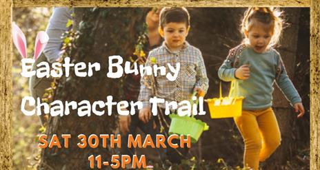 Two young children with easter egg baskets walking a trail to publicise Easter Bunny Character Trail on Saturday 30th March