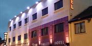 outside image of The Valley Hotel at night with external lighting