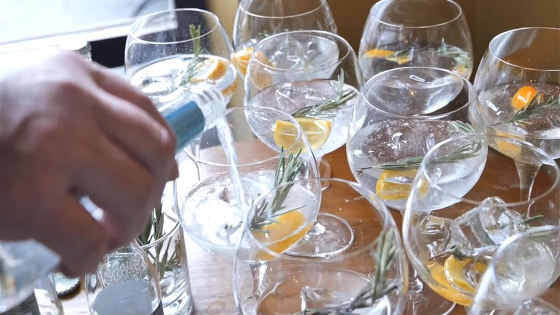 Gin glasses being filled