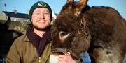 owner Robert and brown donkey