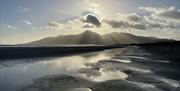 Photo of the Mourne mountains from Murlough beach on a sunny day.
