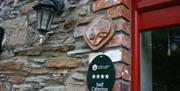 Mill Cottage - Tourism NI plaque showing 4 star award for self-catering