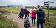 Family walking along the trail at Castle Espie