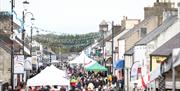 Crowds and stalls fill the main street in Bushmills