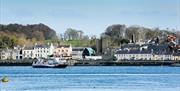 A photo of the picturesque view of Portaferry town from Strangford Lough. The Strangford Ferry is in the shot.