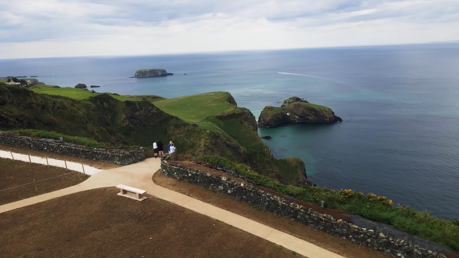 people standing on the viewing platform at Portaneevy View Point. Sheep Island and Carrick a rede island can be seen in the background