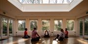 Group sitting down inside enjoying the Journey into Stillness experience