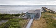 Limekiln Observatory. A glass building overlooking the estuary of Strangford Lough.