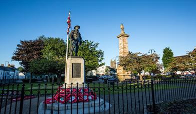 Photo of the Rollo Gillespie Monument standing tall in the centre of Comber Square