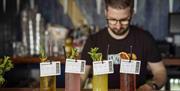 A barman creates bespoke cocktails on the Sensorium experience