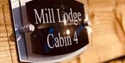 Sign of mill lodge cabin 4