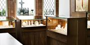 Wood and glass display cases with jewellery