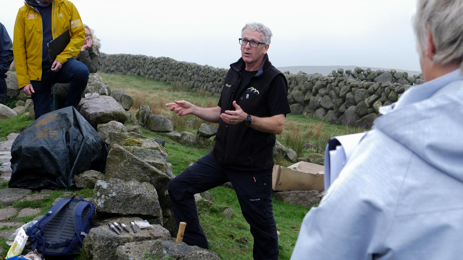 Stone Masons of Mourne Experience - Peter talking to a group of walkers by stone wall