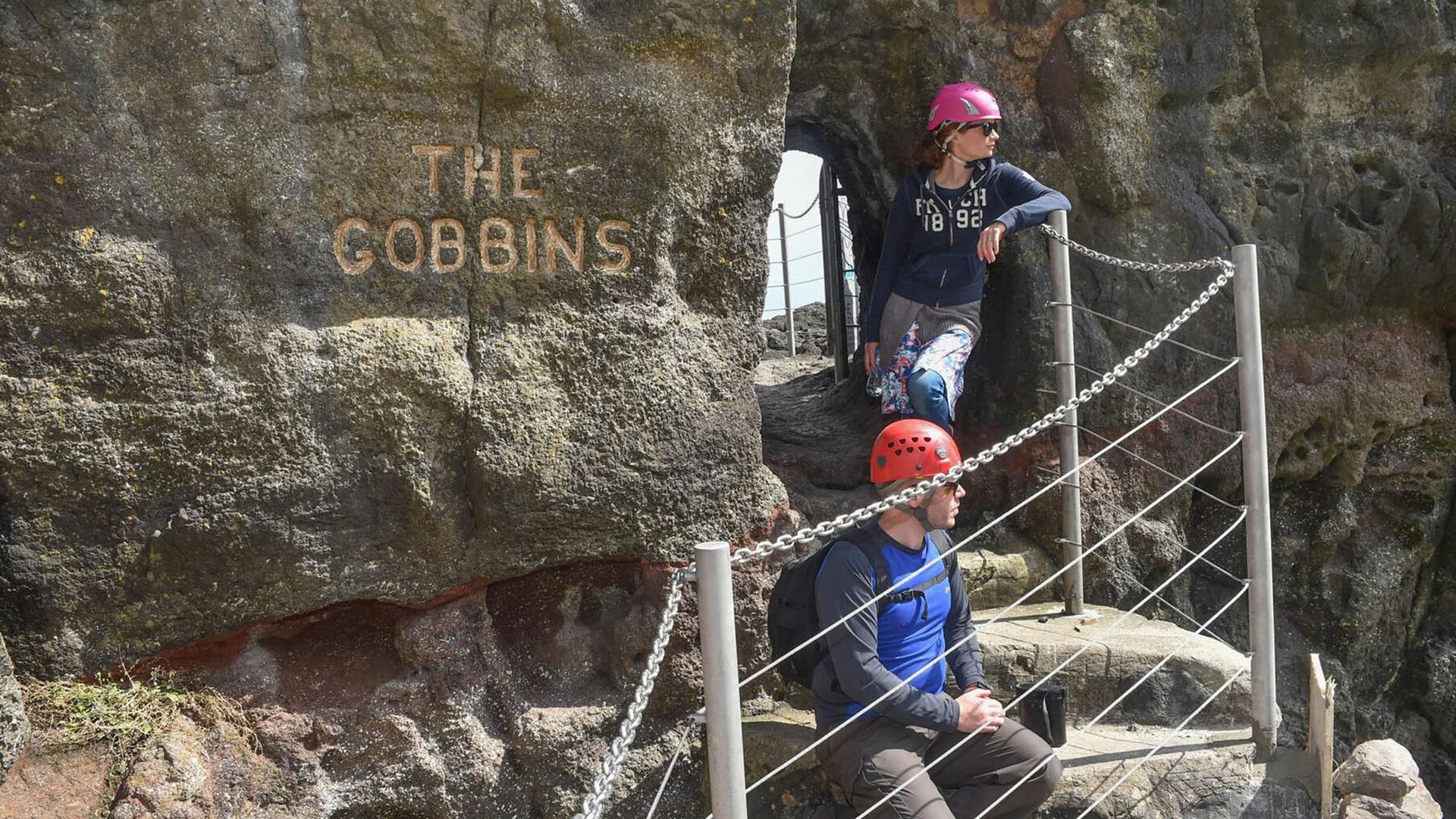 a male and female at the entrance of the Gobbins Cliff path