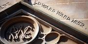 Photo showing the embossed words Edward Ward 1852, the date the Town Hall was erected